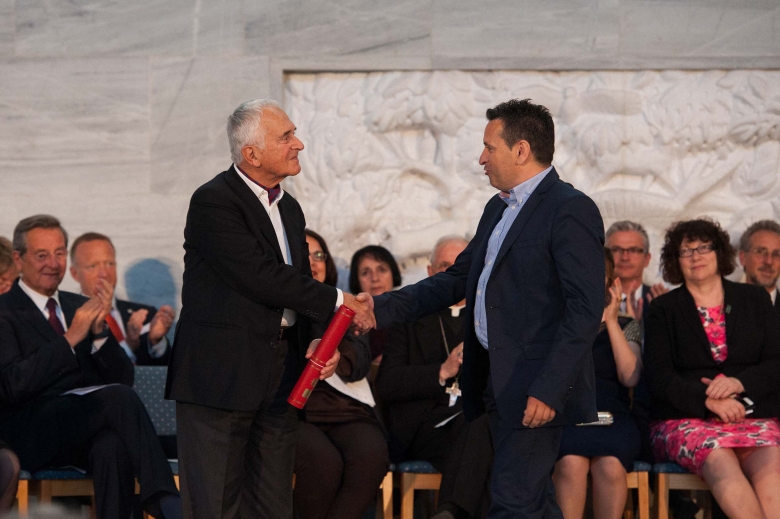 Representative from the Restoration of Lasithi Plateau’s Windmills with Perforated Sails receiving the award from the Chairperson of Category Research and Digitisation Photo: Espen Sturlason